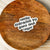 funny sticker pretty font easily distracted by guns and coffee on wooden bowl